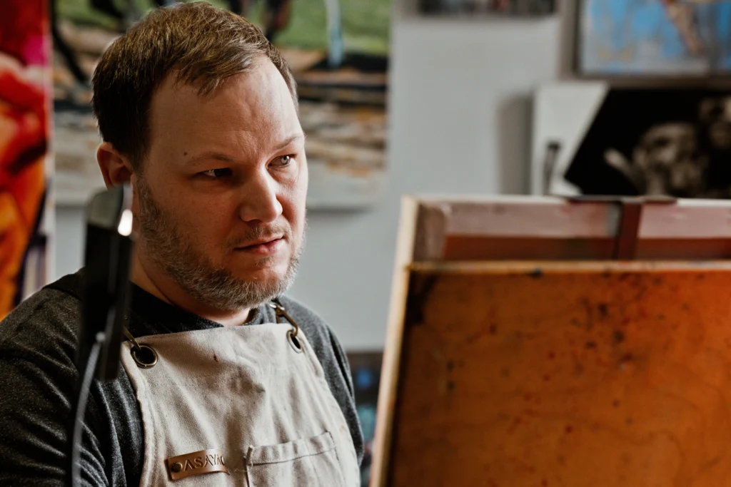 Cincinnati entrepreneur working on a piece of art during a photo session