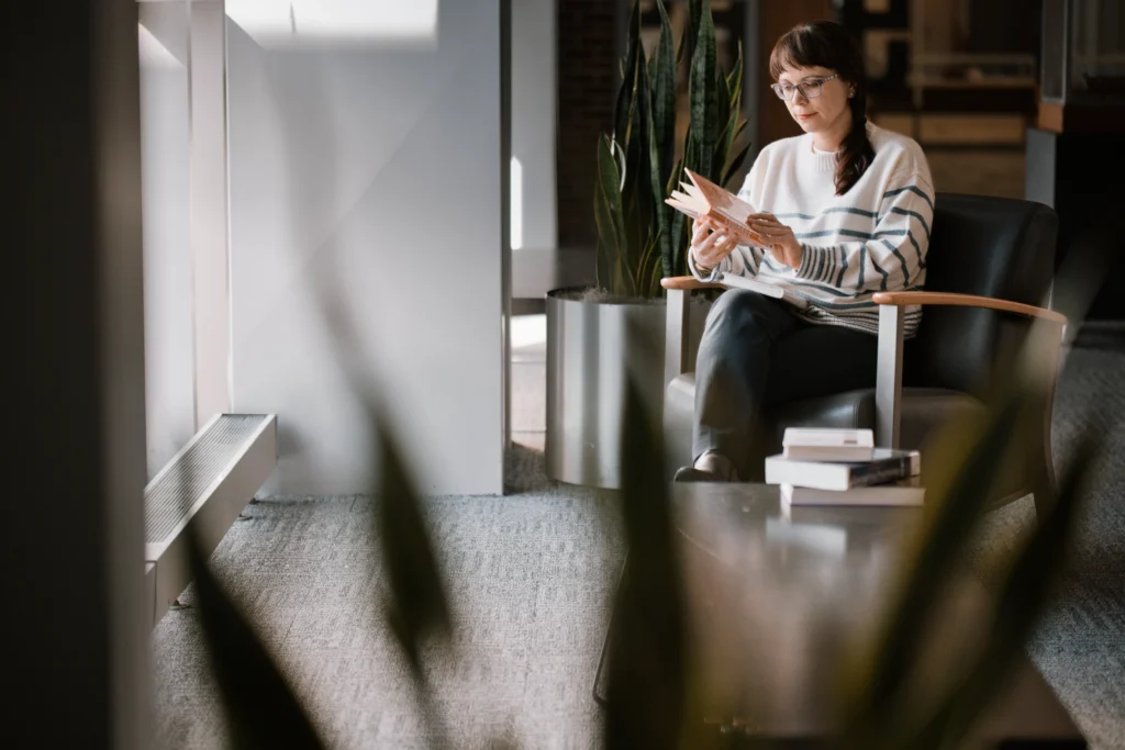Woman entrepreneur browsing through books at a Cincinnati library