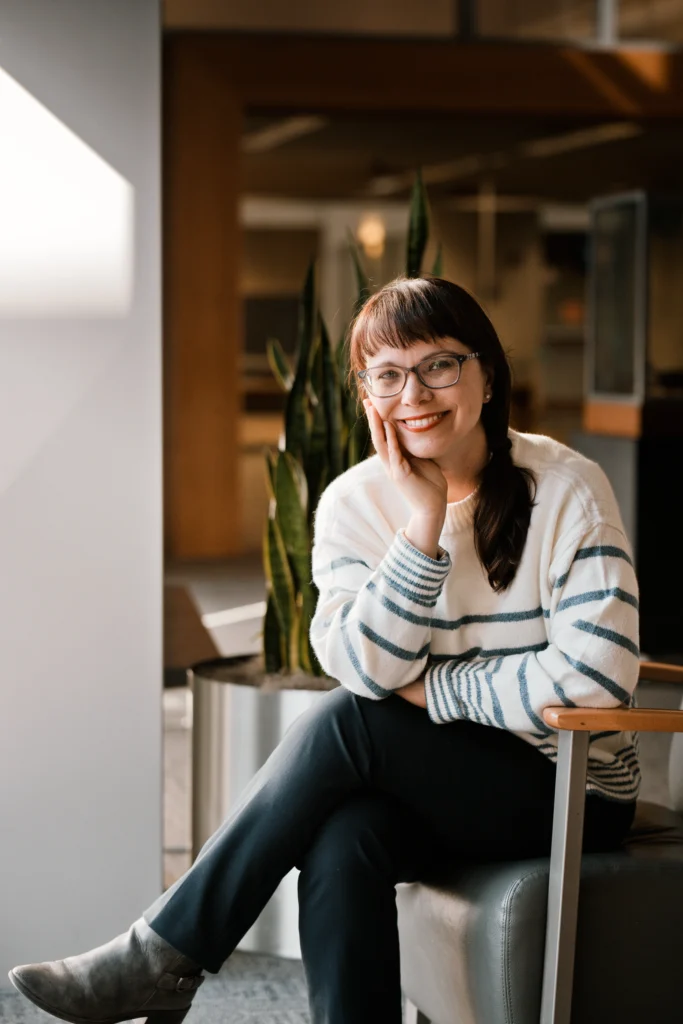 a woman entrepreneur smiling into camera during a Cincinnati photo session