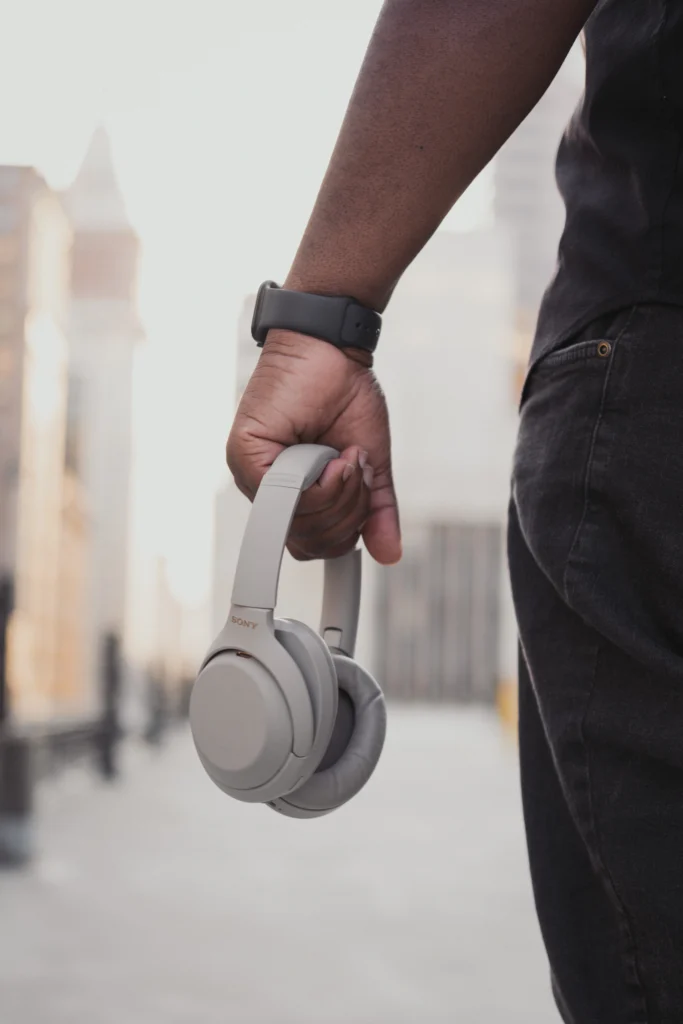 man entrepreneur posing on a Cincinnati rooftop with a dj head set