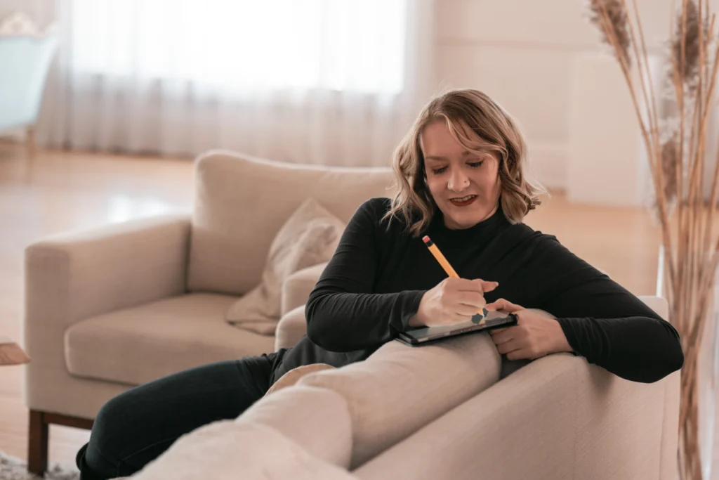 Cincinnati woman entrepreneur writing a business note in a studio during a personal photo session