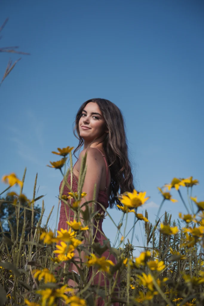Cincinnati high school senior photographed in a field of flowers