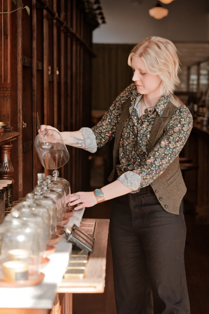woman entrepreneur arranging details at her Newport, Ky business