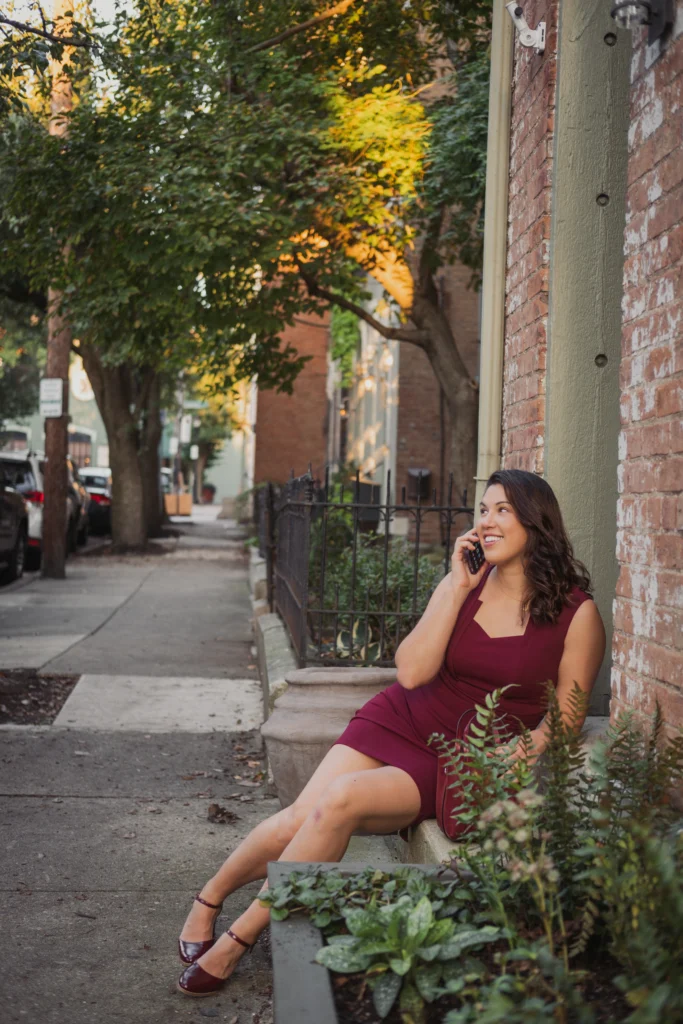a woman entrepreneur speaking on the phone in the Over-the-Rhine neighborhood of Cincinnati