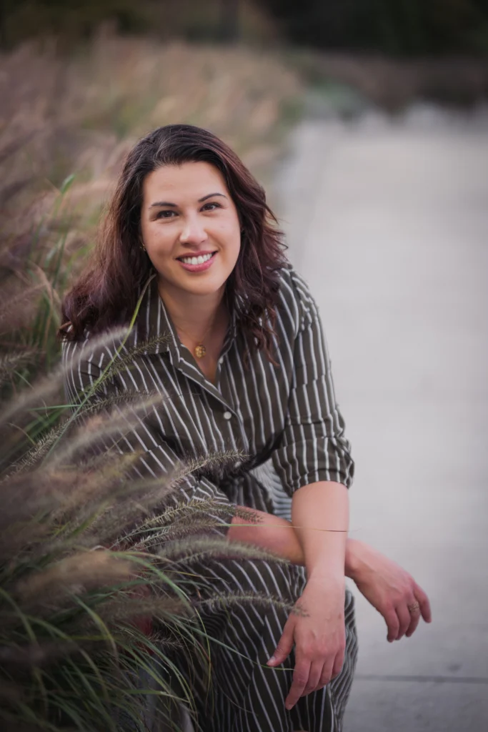 a woman entrepreneur posing in the Over-the-Rhine neighborhood of Cincinnati