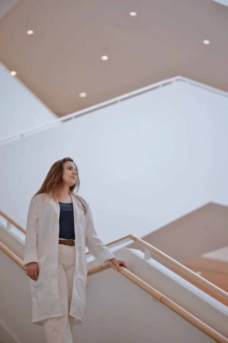 woman looking off camera on stairs branding session at university of cincinnati ohio
