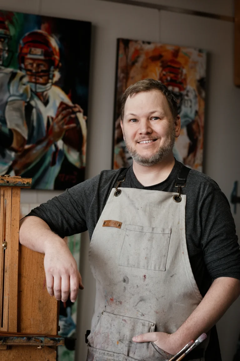 man standing by his easel in his studio branding session cincinnati ohio